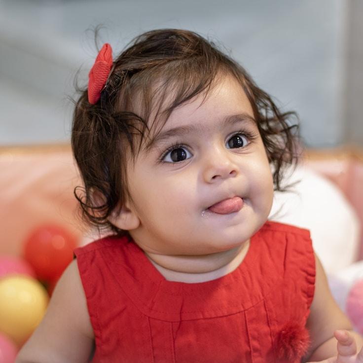 Kaveri Mehta, Lead Design Curator at HarrowMossGarden, reviewing corporate floral arrangements